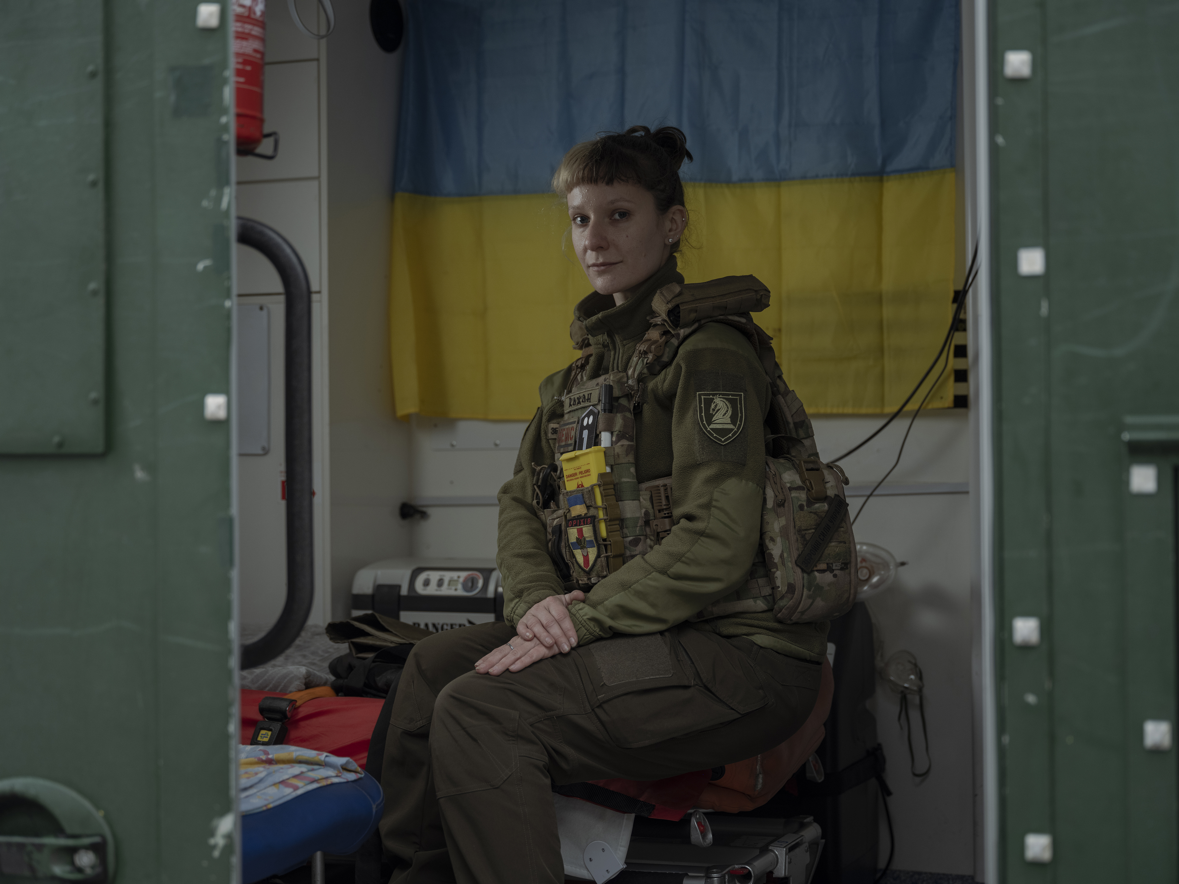 Soldier in front of Ukraine flag