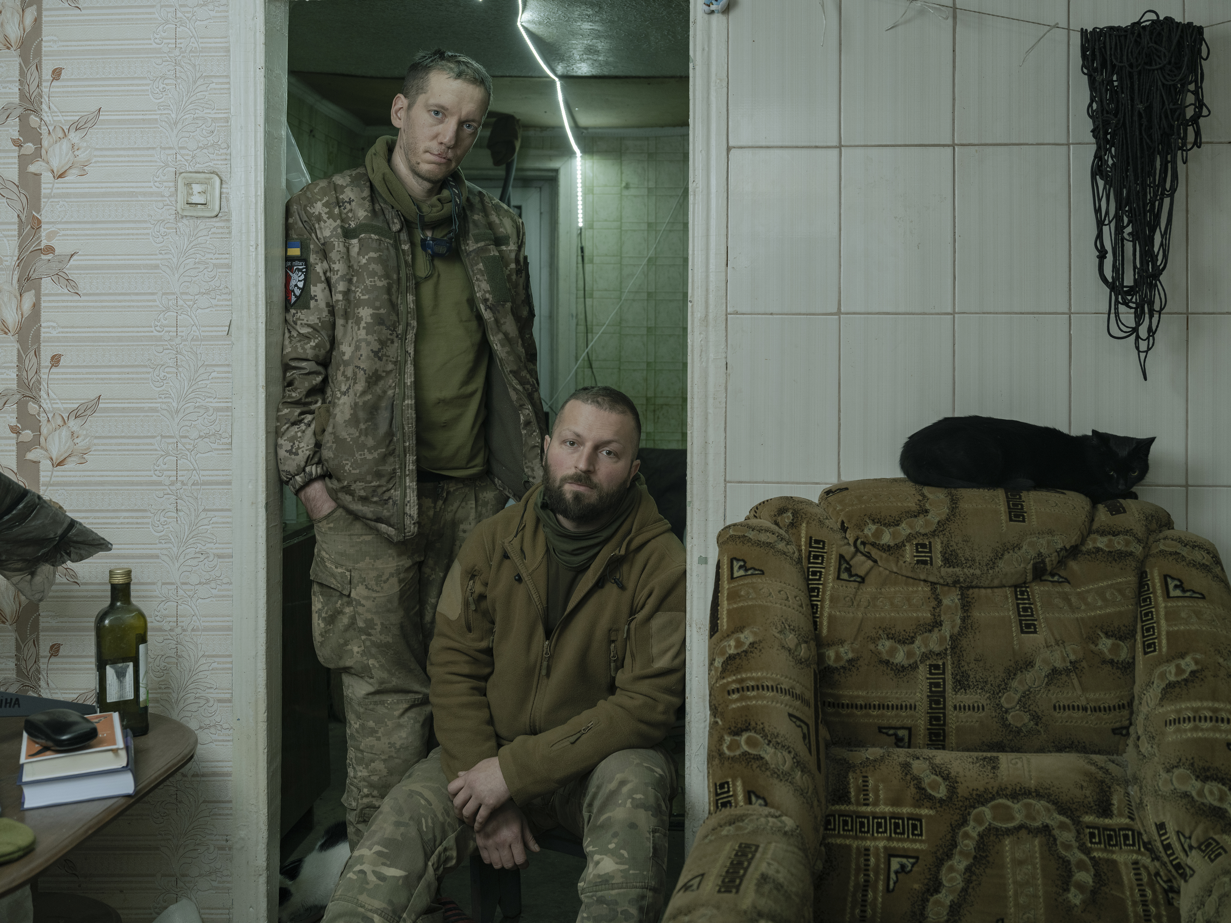 Two soldiers in an abandoned house