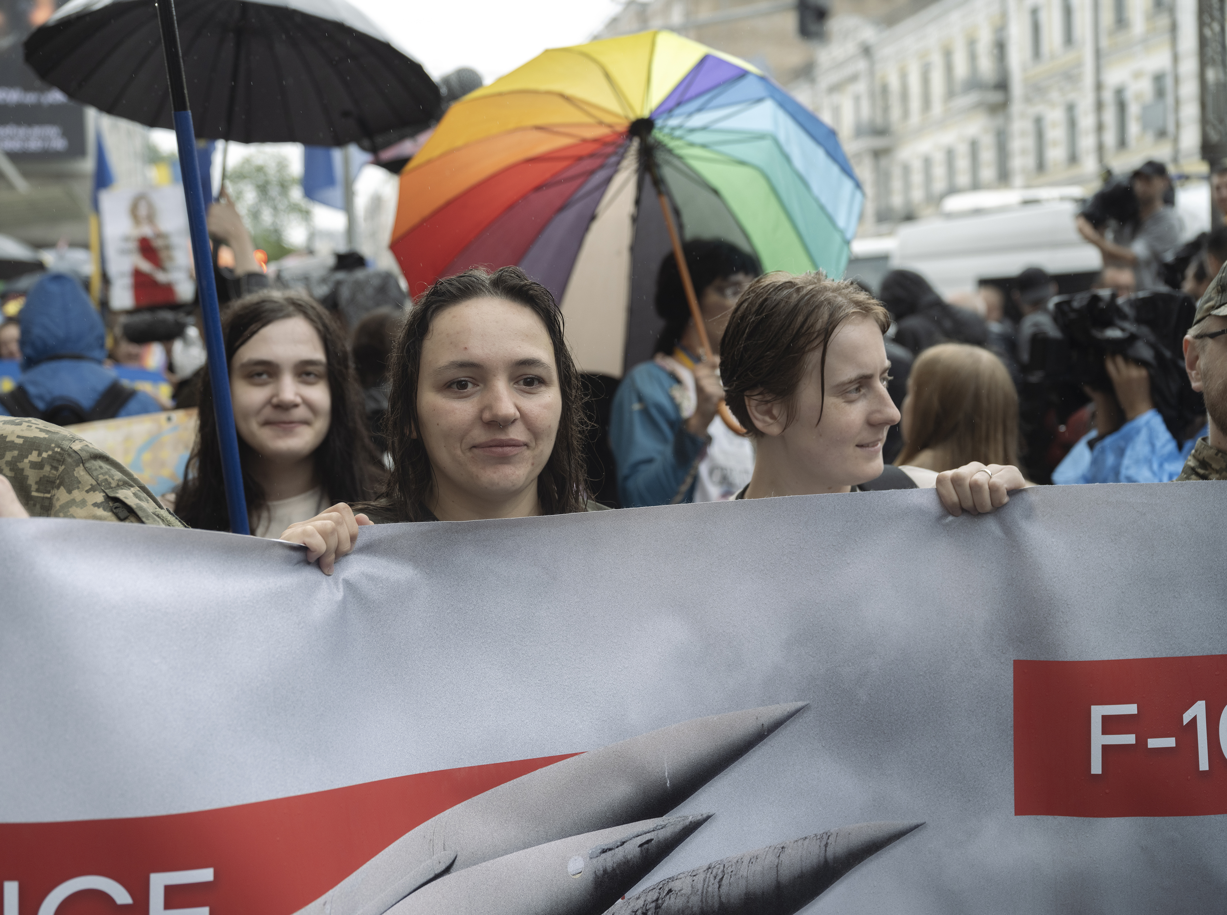 People holding a banner at Kyiv Pride 2024