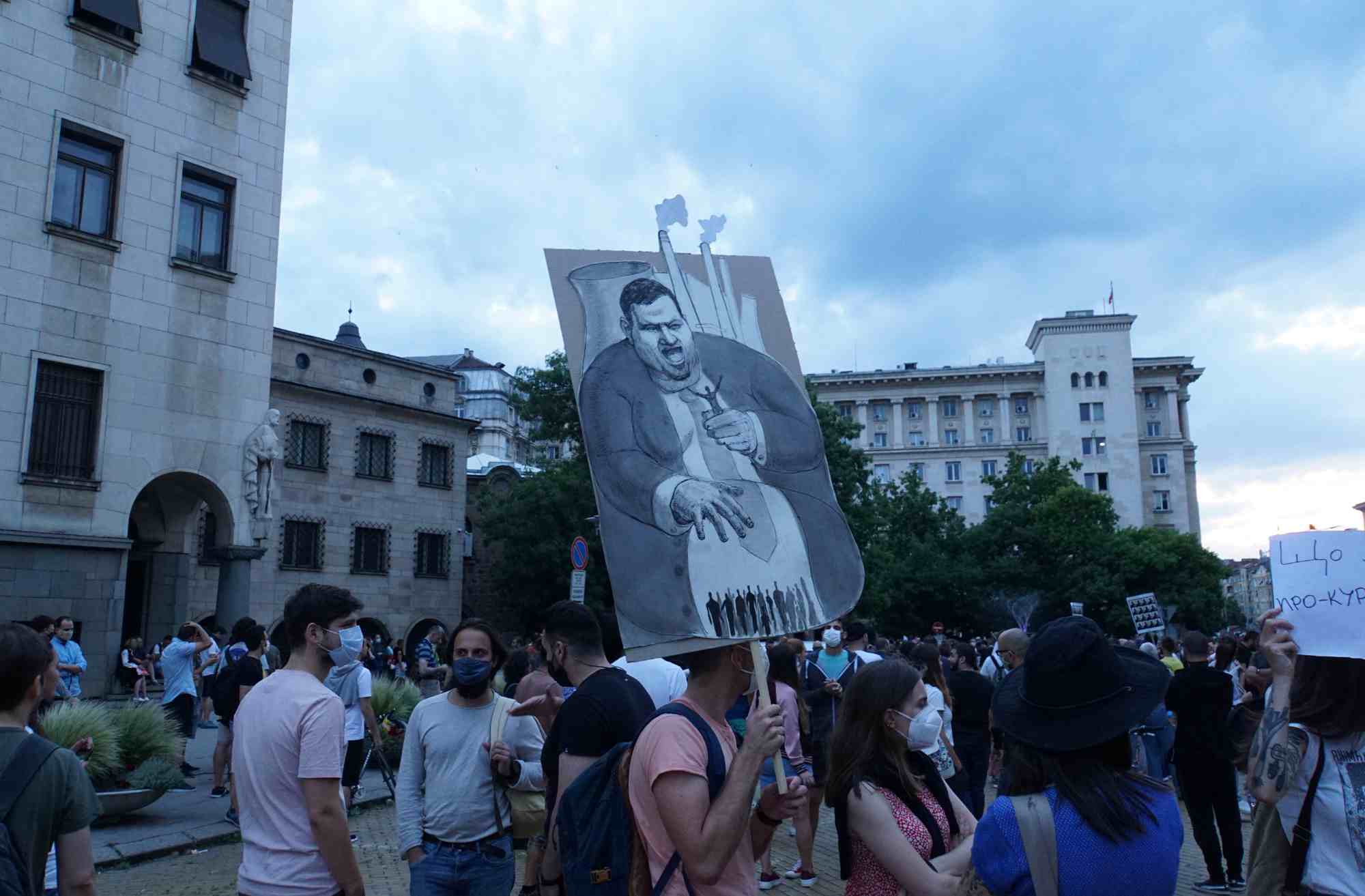 Protesters hold a poster with the symbol of the Bulgarian oligarchy Delyan Peevski, who took over most of the country’s businesses (Sofia, July 14 2020)