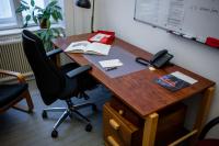 Photo of an IWM office with a desk and a chair 