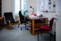 Fellows Office at the IWM with a desk, two chairs and some things laying around the desk