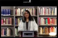 Shalini Randeria standing at a lecture in the IWM library